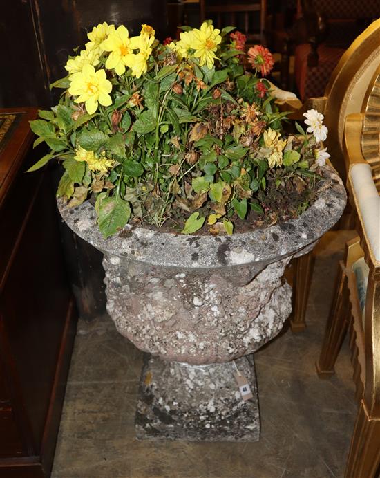 A reconstituted stone garden urn, Height 68cm